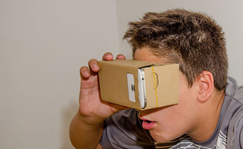 Close-up of boy wearing virtual reality simulator