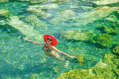 High angle view of woman swimming in sea