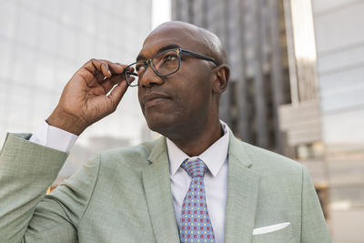 Mature businessman with eyeglasses at financial district