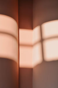 Pastel pink wall with shadow pattern