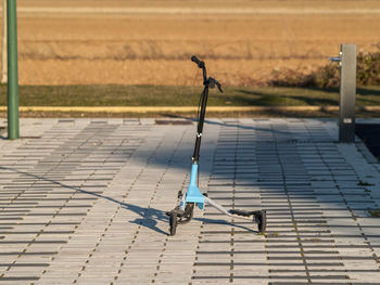 Close-up of cycle on street