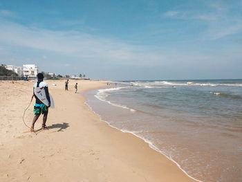 Scenic view of beach in sunny