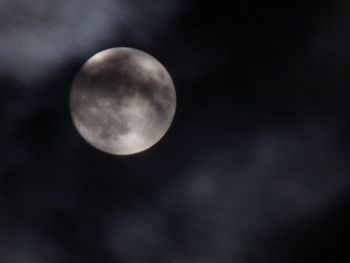 Low angle view of moon against sky at night