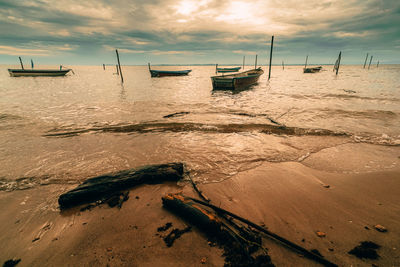 Scenic view of beach against sky during sunset