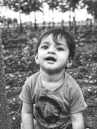 Portrait of boy on field