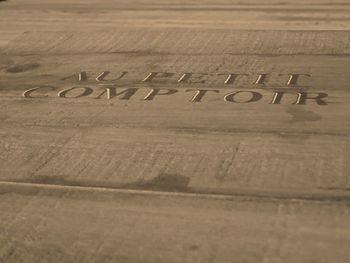 High angle view of text on wooden table