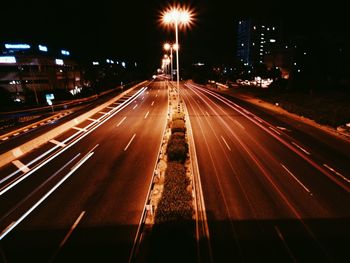 Illuminated city street at night