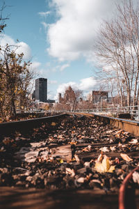 Surface level of railroad tracks against sky
