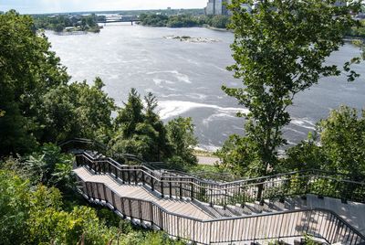 High angle view of trees by water against sky