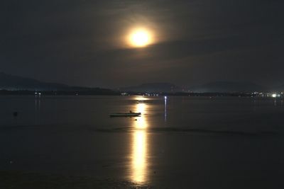 Scenic view of sea against sky at night