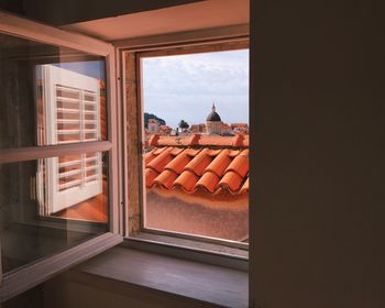 Tiled roof seen through window