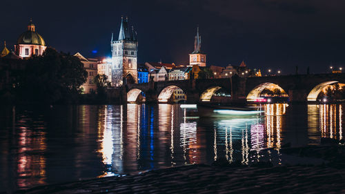 Illuminated buildings in city at night