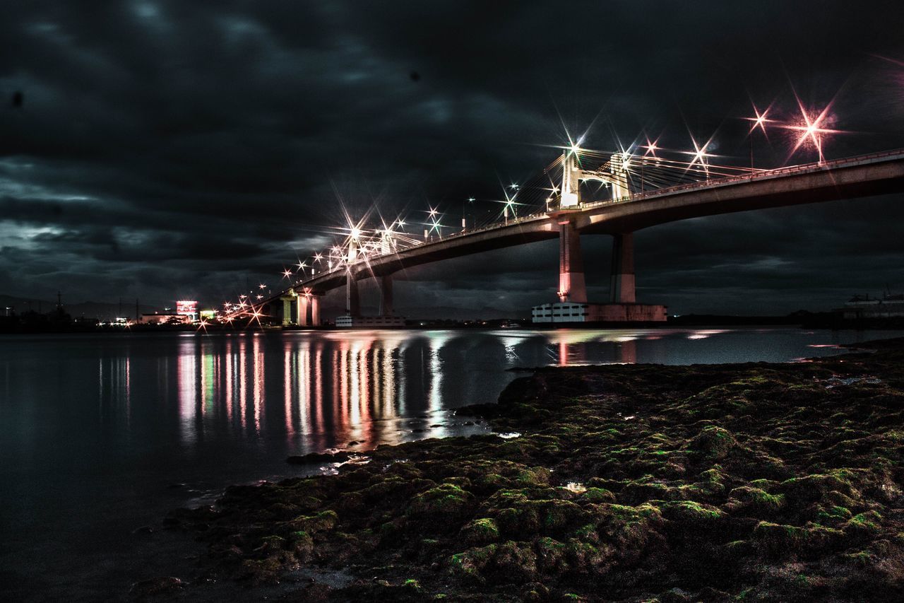 bridge - man made structure, connection, night, river, sky, outdoors, water, illuminated, architecture, built structure, city, no people, firework display, firework - man made object