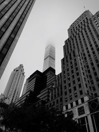 Low angle view of skyscrapers against sky