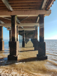 Pier over sea against sky