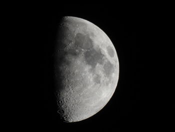 Low angle view of moon against clear sky at night