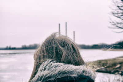 Rear view of woman against sky