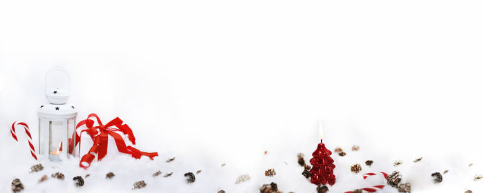 High angle view of christmas decorations over white background