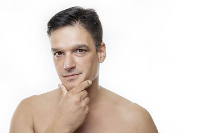 Portrait of young man against white background