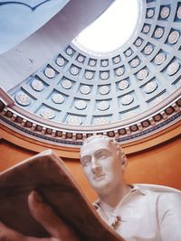 Low angle view of statue against building