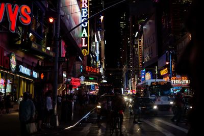 People on city street at night