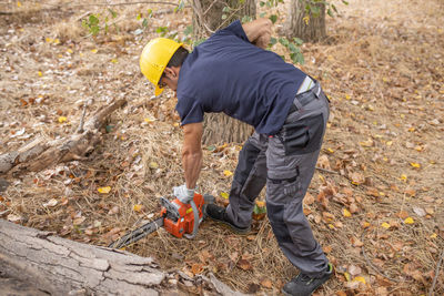 Low angle view of man working at construction site