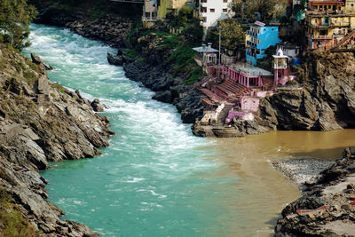 High angle view of waterfall by sea