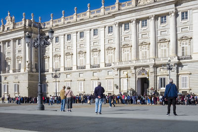 People in front of historic building