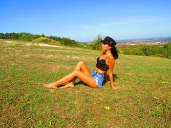 Full length of woman on field against sky