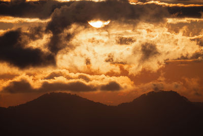 Low angle view of dramatic sky at sunset