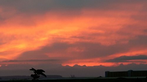 Scenic view of dramatic sky during sunset