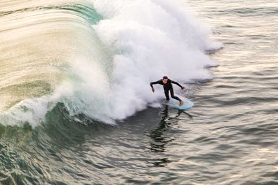 People surfing in sea