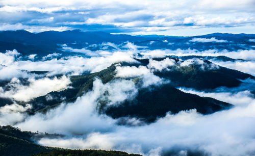 Aerial view of majestic mountains against sky