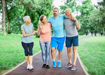 Rear view of people walking outdoors