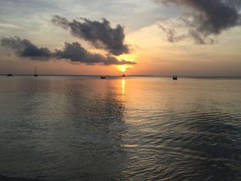 Scenic view of sea against cloudy sky