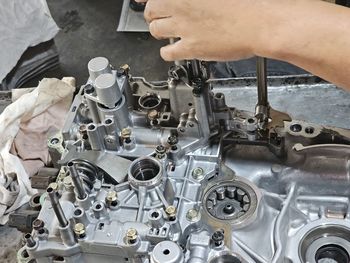 Cropped hand of man working in factory