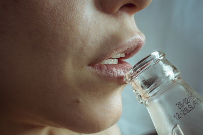 Close-up of a woman drinking glass