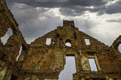 Old manor bricks ruin with dramatic sky. republic of paulava, lithuania