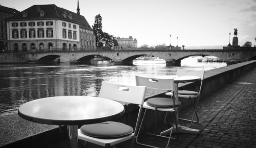 View of bridge over river against buildings