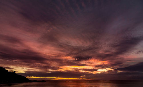 Scenic view of sea against dramatic sky