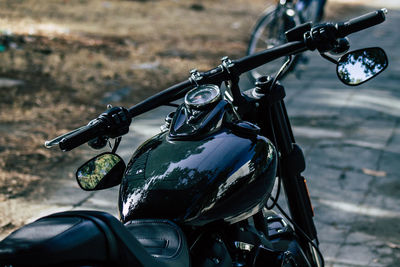 Close-up of bicycle on street