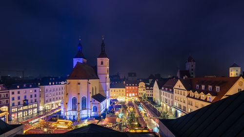 Illuminated buildings in city at night