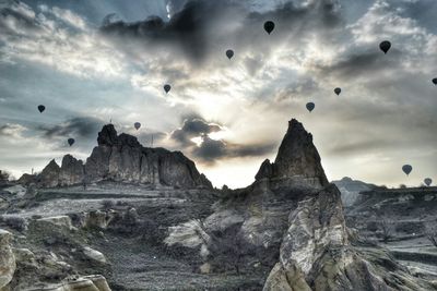 Scenic view of rocky mountains against cloudy sky