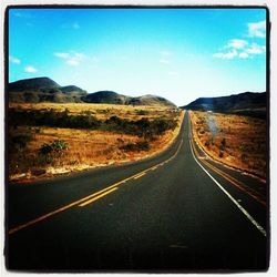 Country road passing through landscape