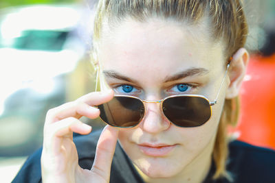 Close-up portrait of boy wearing sunglasses