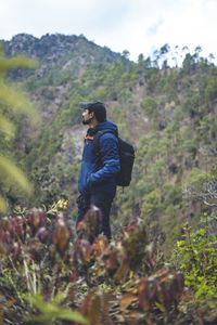 Rear view of man standing on field