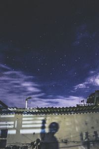 Low angle view of building against sky at night