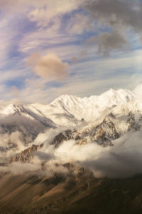 Scenic view of snowcapped mountains against sky