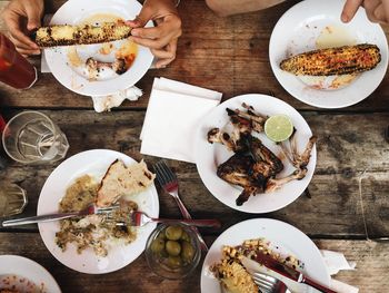 Directly above shot of people having food in restaurant