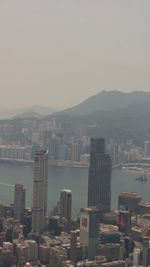High angle view of buildings in city against clear sky